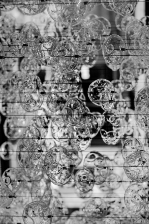 Swirling patterns of transparent shapes create a whimsical dance of light and shadow.