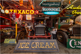 Vintage vehicles and neon signs create a nostalgic ambiance.