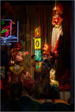A vibrant display of clowns in a colorful, neon-lit setting.