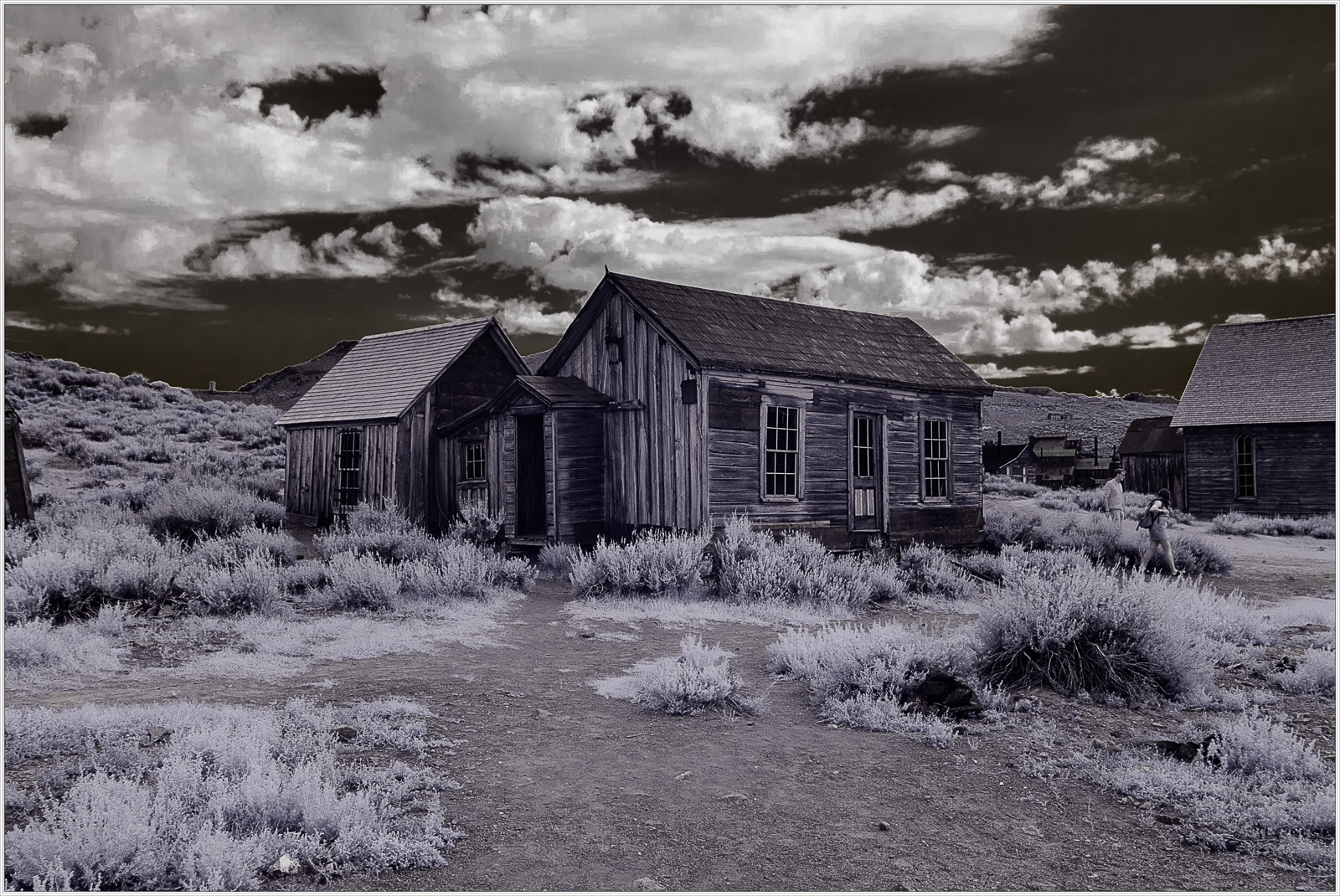 Historic wooden structures in a ghost town, showcasing early civic infrastructure.