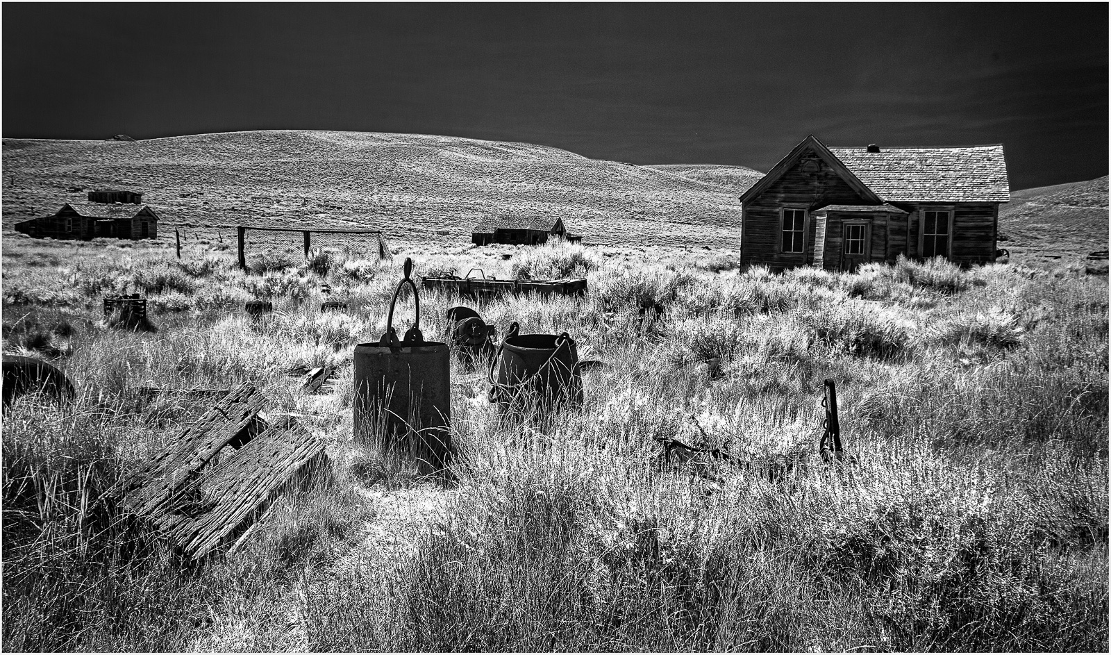 Abandoned structures in Bodie, showcasing remnants of a once-thriving mining town.