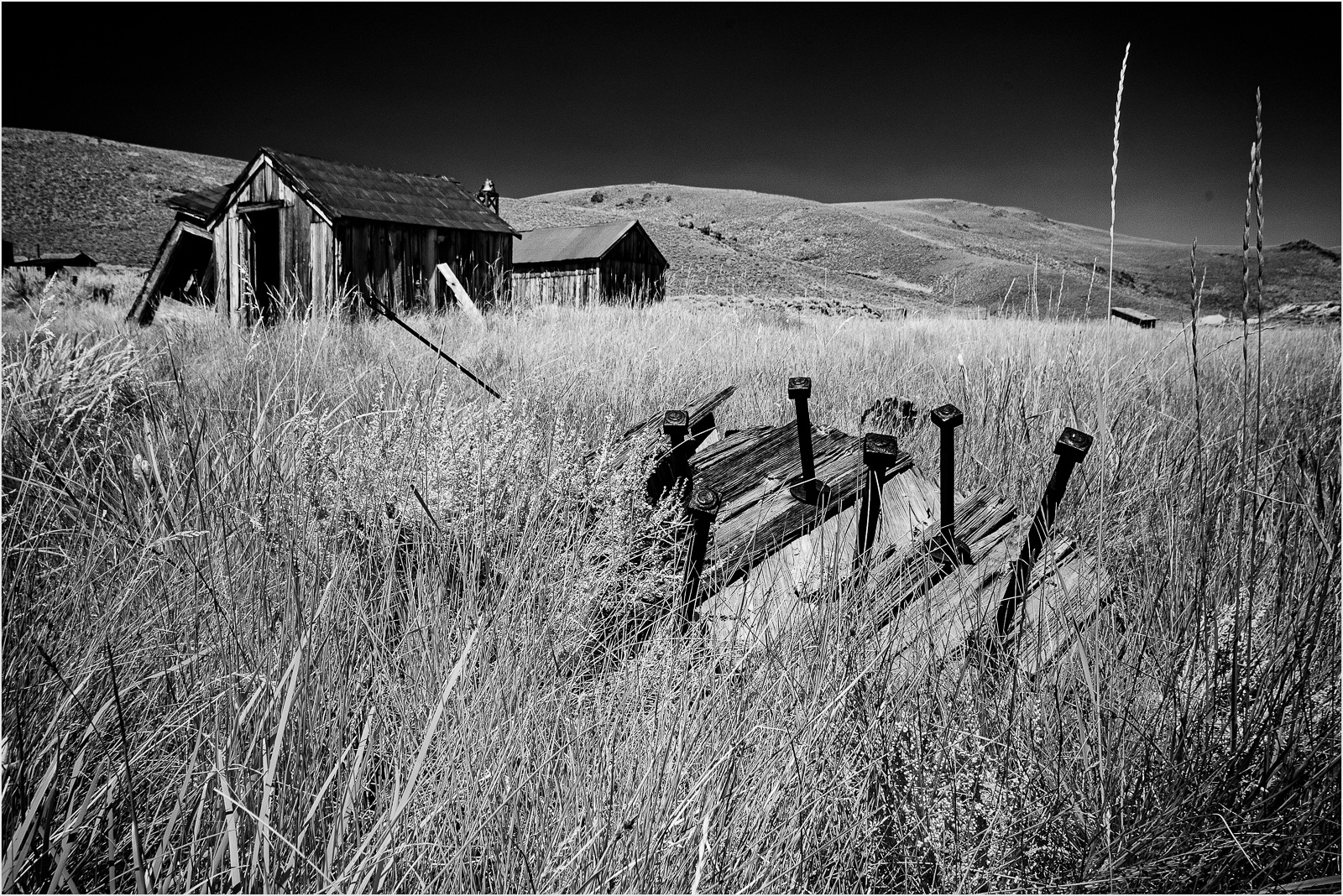 Abandoned structures in Bodie, showcasing remnants of a historic mining town.
