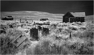 Abandoned structures in Bodie, showcasing remnants of a once-thriving mining town.