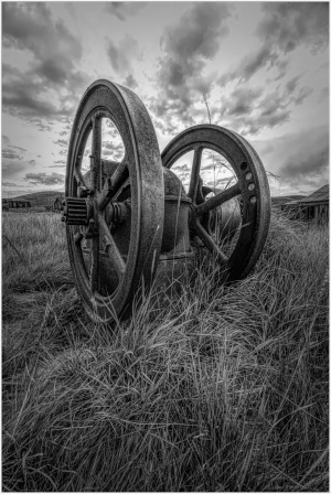 Historic machinery in a ghost town, hinting at past infrastructure efforts.