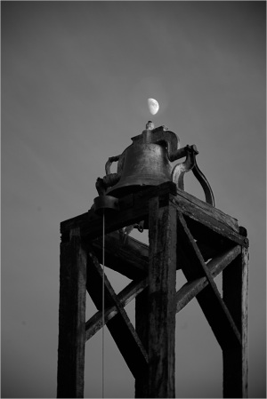 Historic bell tower silhouetted against the sky, a remnant of civic life.