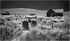 Abandoned structures in Bodie, showcasing remnants of a once-thriving mining town.