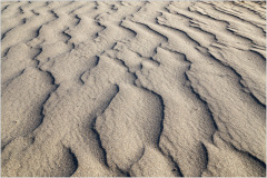 Rippling patterns of sand create a surreal landscape in Death Valley.