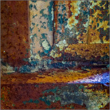 Close-up of rusted metal with vibrant colors and textures.