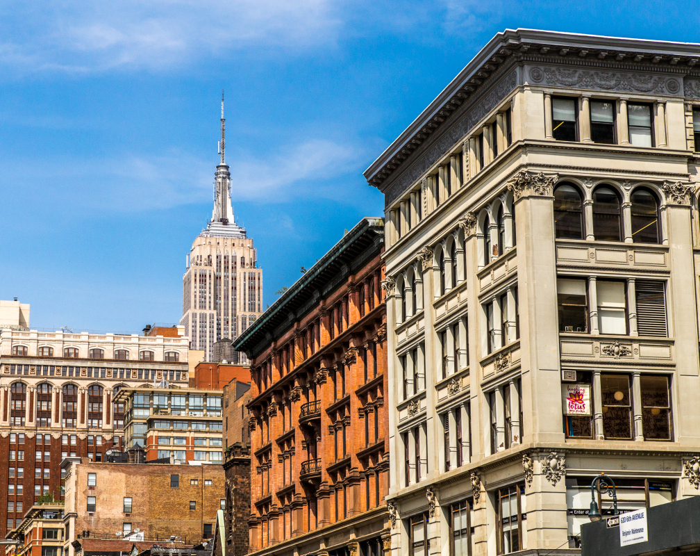 Empire State Building towers above a mix of historic and modern buildings.