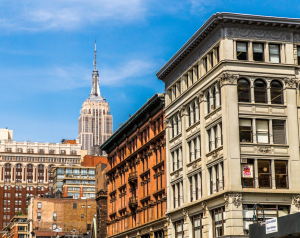 Empire State Building towers above a mix of historic and modern buildings.