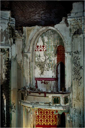 Decaying theater with cracked walls and faded decor, a haunting stage of lost performances.