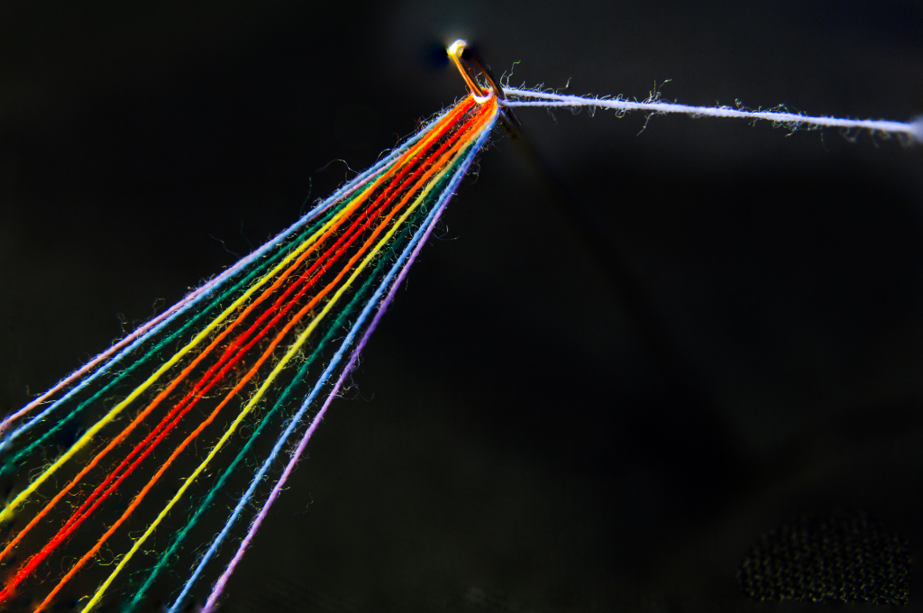 A close-up of a light beam splitting into vibrant rainbow colors.