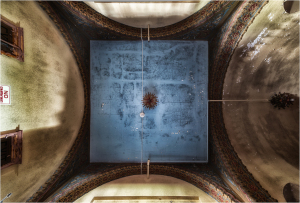 Ceiling of Irem Temple Theater with a blue surface and intricate architectural details.