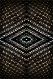 Intricate patterns weave a tapestry of shadows and light, forming a mesmerizing labyrinth.