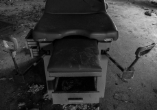 Medical exam table left to decay