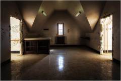 Interior of a detention facility with two open doors and a central counter area.