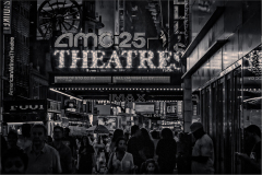 Crowd in front of AMC 25 Theatres in Times Square, New York City at night.