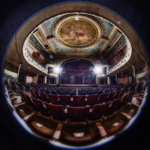 Interior of the Orpheum Theater, showcasing ornate ceiling and empty red seats.