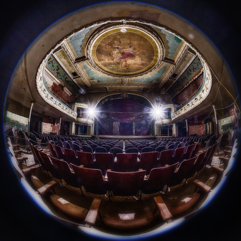 Interior of the Orpheum Theater, showcasing ornate ceiling and empty red seats.