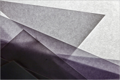 Layered translucent materials in varying shades of gray and purple, creating depth.