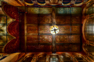 Intricate ceiling of the Paramount Theatre, showcasing faded grandeur and forgotten artistry.
