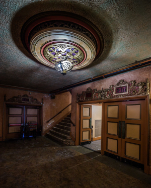 Glamorous entrance of the Paramount Theatre with ornate ceiling and grand doors.