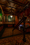 Interior of the Paramount Theatre, showcasing ornate details and a sense of abandonment.