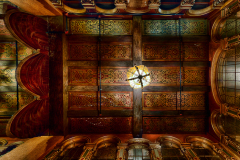 Intricate ceiling of the Paramount Theatre, showcasing faded grandeur and forgotten artistry.