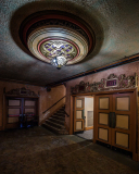 Glamorous entrance of the Paramount Theatre with ornate ceiling and grand doors.