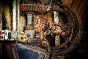Close-up of rusty gears and machinery, showcasing intricate metalwork.
