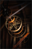 Close-up of vintage mill machinery with wooden and metal components.