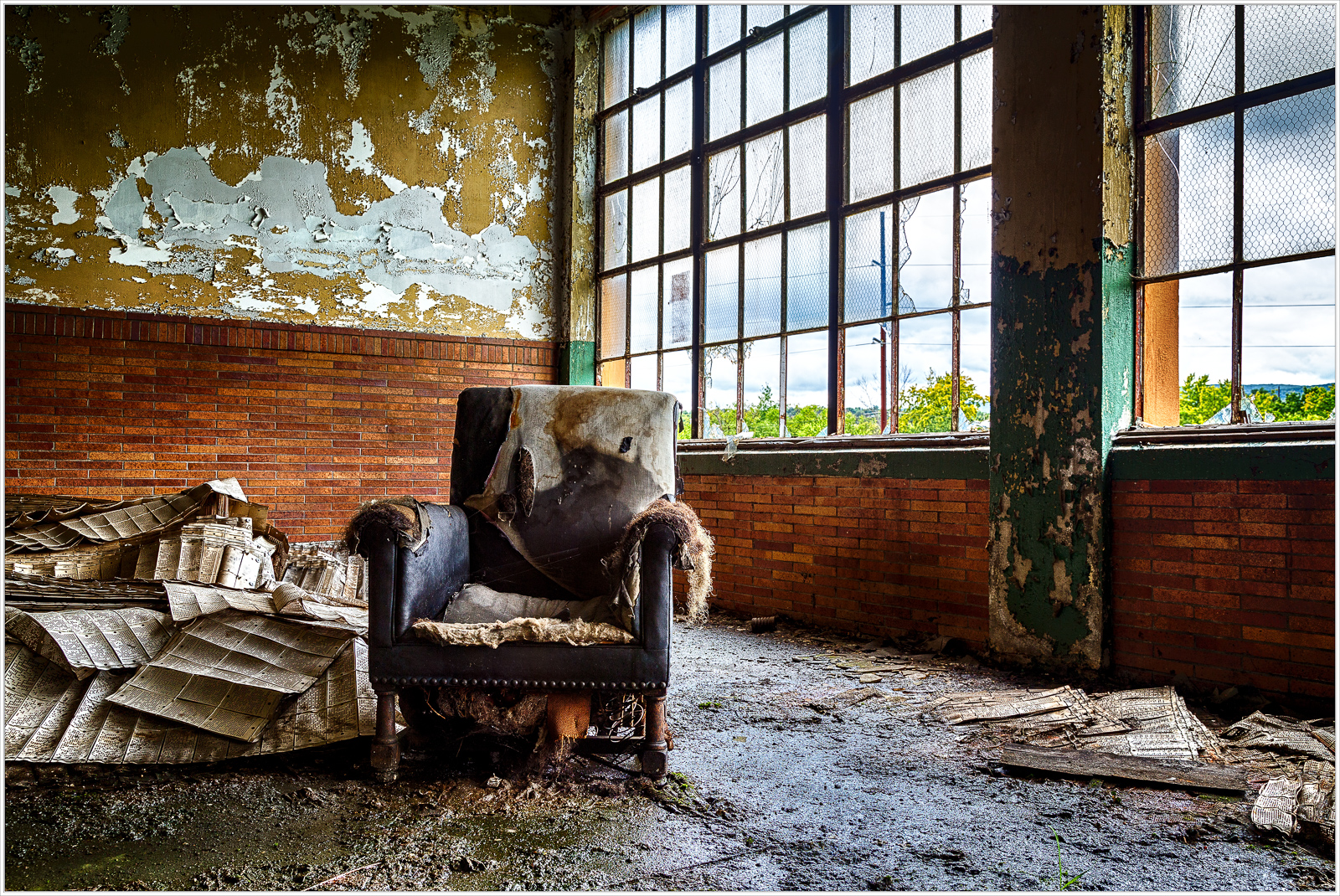An abandoned chair amidst the remnants of forgotten times, whispers of history linger.