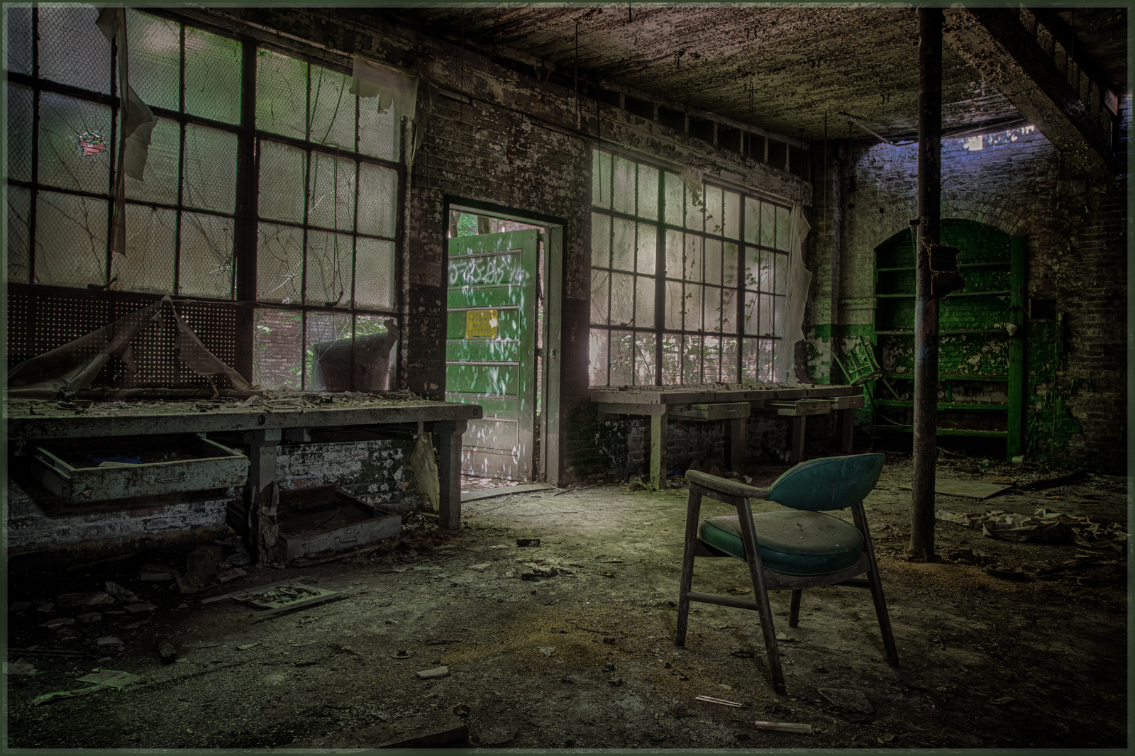 An abandoned space, where shadows stretch and light plays on decaying surfaces.