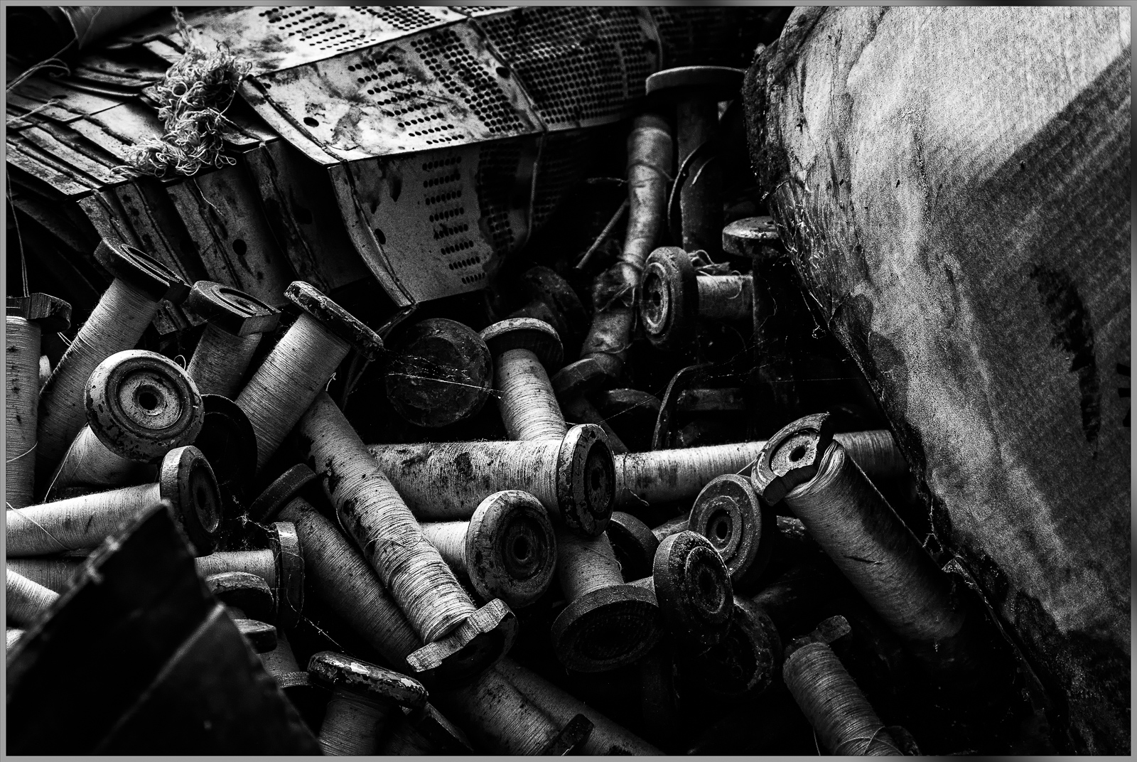 A tangle of discarded metallic components, weathered and rusted, reveals the passage of time.