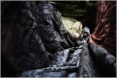 Intricate layers of lace exhibit a tapestry of colors and textures.