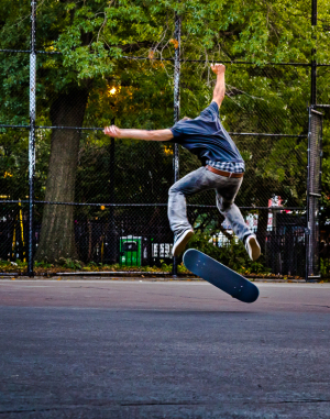 A skateboarder performs an impressive trick mid-air, defying gravity and logic.