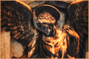 A weathered angel statue with majestic wings and a halo, exuding timeless grace.