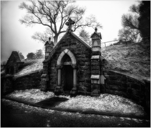 A hauntingly beautiful mausoleum draped in ghostly snow.