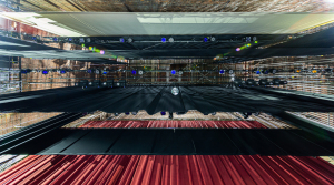 View of the Strand Theater's stage from above, showcasing curtains and rigging.