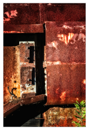 Rusty metal panels in a dimly lit trolley graveyard, shadows cast dramatically.