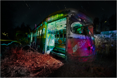 An abandoned trolley, cloaked in shadows, emanates an eldritch glow amidst the encroaching darkness.