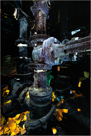 Intricate machinery intertwined with shadows, illuminated by soft glimmers.