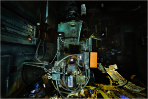 A surreal machine enveloped in shadows, pulsating with strange colors and forms. Unseen energy courses through its metal